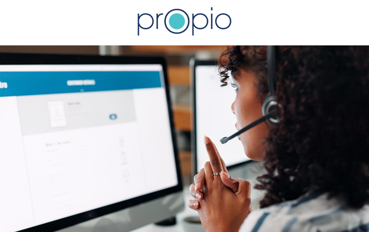 Propio — woman with headset looking at computer