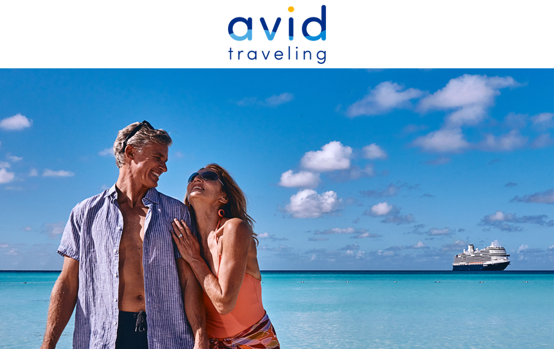 A couple smiling on a beach after they used Avid Traveling