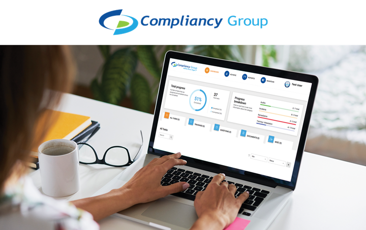 Member Advantage Dentist reading about Compliancy Group on tablet