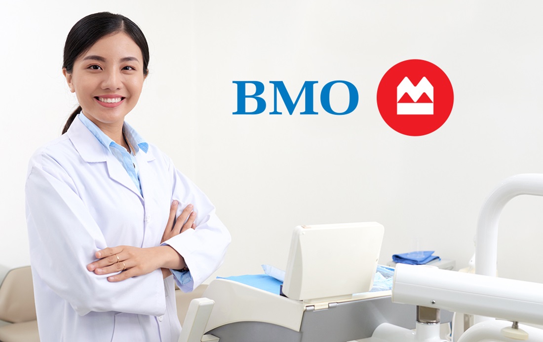 A photograph of a dentist in her examination room that features the BMO Harris Bank logo.